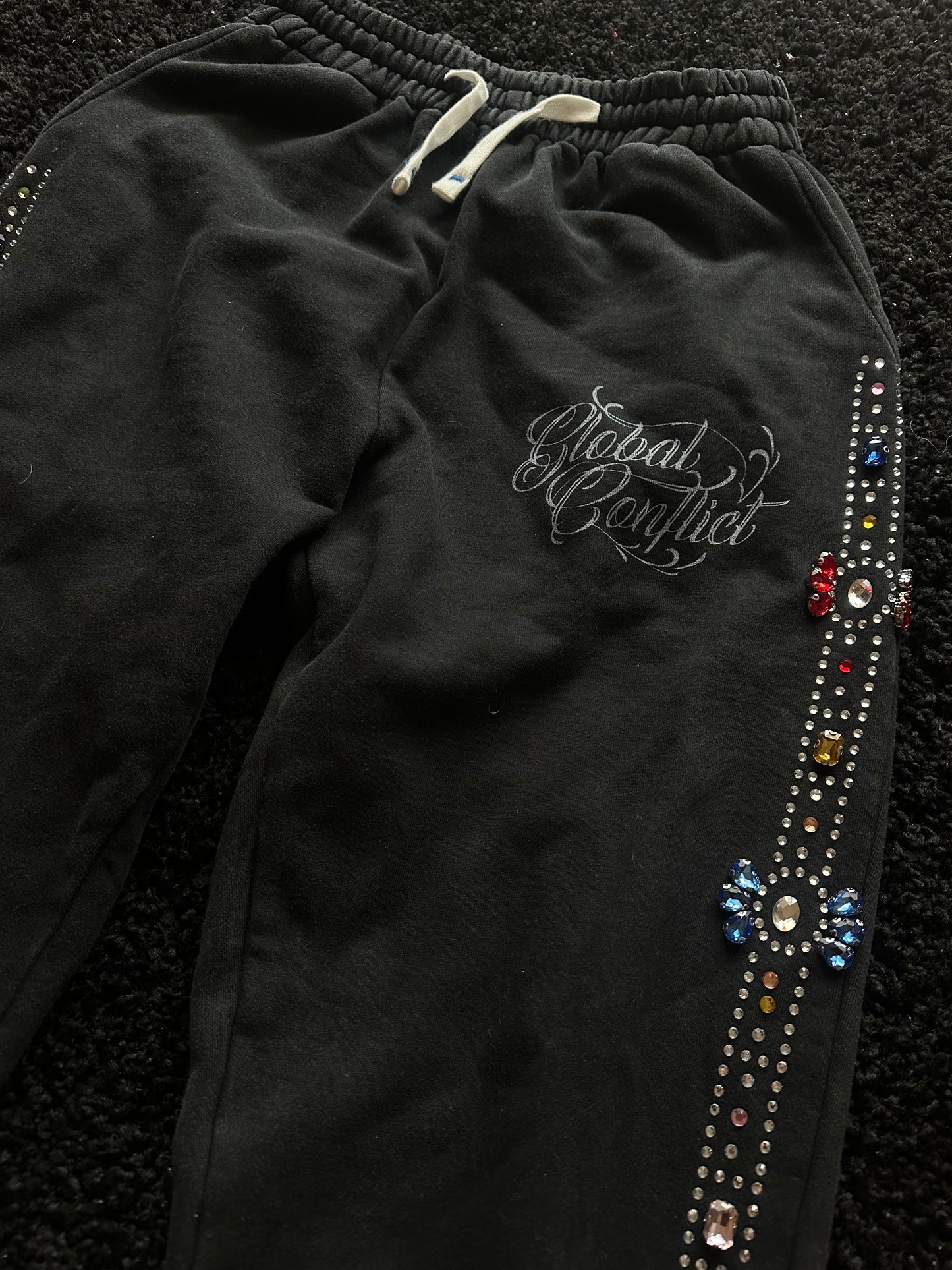 GLOBAL CONFLICT RHINESTONE π SWEATPANTS