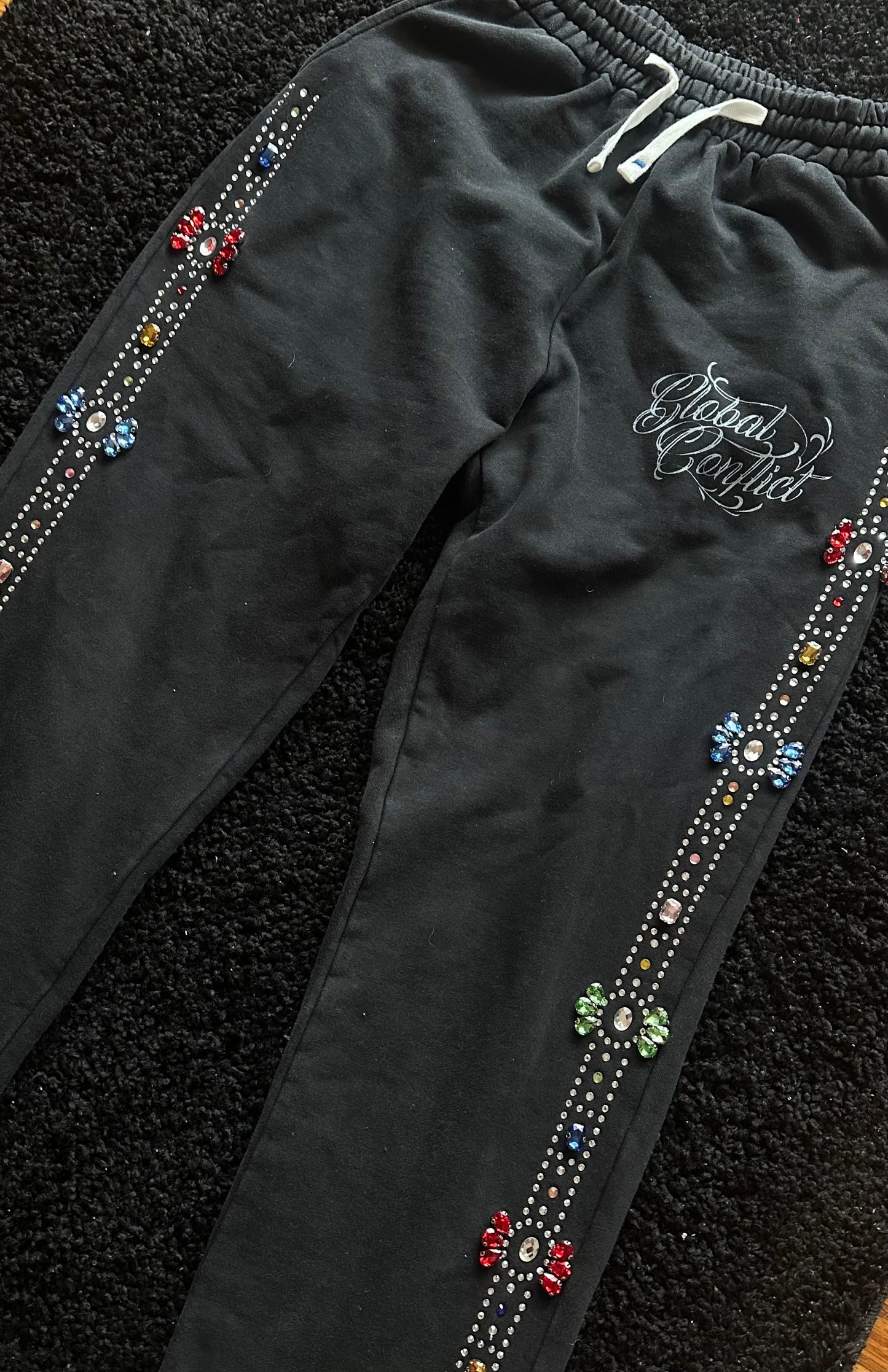 GLOBAL CONFLICT RHINESTONE π SWEATPANTS