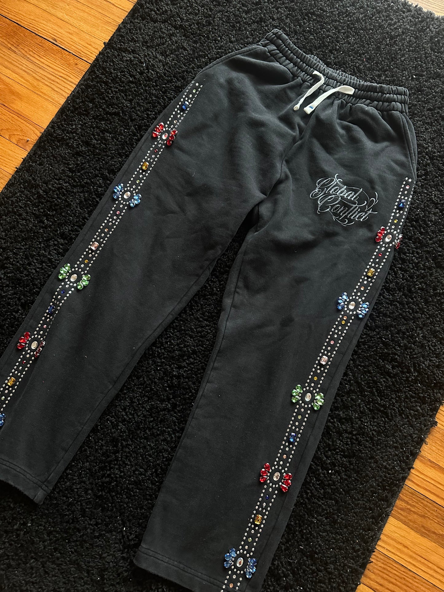 GLOBAL CONFLICT RHINESTONE π SWEATPANTS